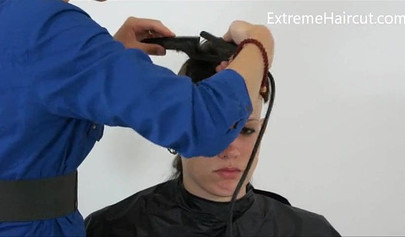 Cute hairdresser makes a punk hairstyle for her girlfriend