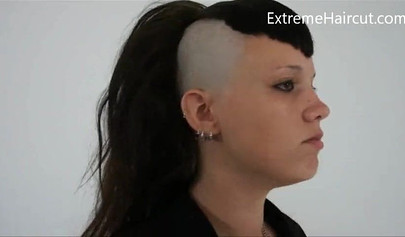 Cute hairdresser makes a punk hairstyle for her girlfriend