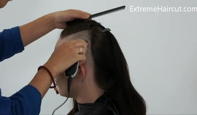 Cute hairdresser makes a punk hairstyle for her girlfriend
