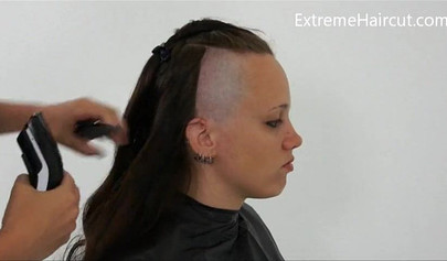 Cute hairdresser makes a punk hairstyle for her girlfriend