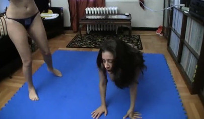 Facesit wrestling with slender beautiful girls on the mat