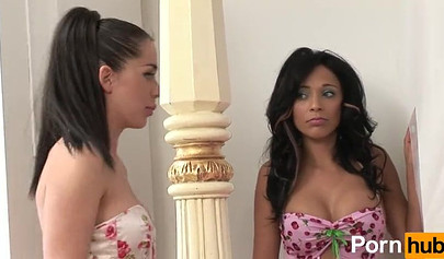 Glamorous brunettes playing with a lilac dildo in the bedroom