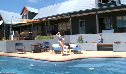 Sexy babes are having fun with a water guns by the pool