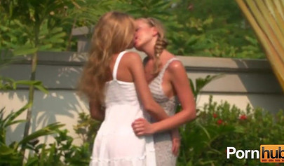 Two young blondes discover each others bodies by the pool