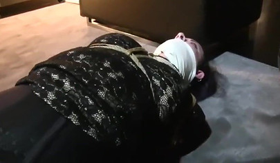 Redhead mistress practices bondage with her submissibve slave