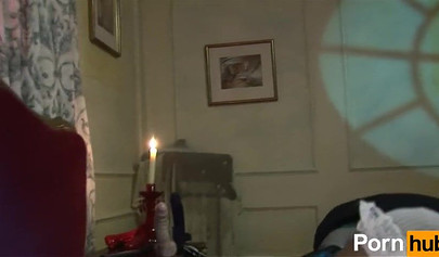 Passionate lesbians drill each other's pussy by candlelight