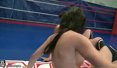 Naked brunettes take part in a wrestling and have fun