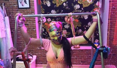 Asian lesbians practice bondage in a BDSM room