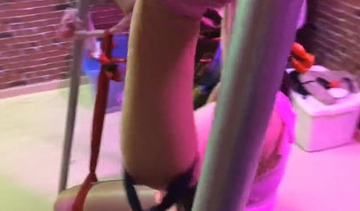 Asian lesbians practice bondage in a BDSM room