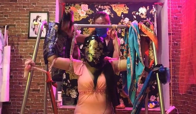 Asian lesbians practice bondage in a BDSM room