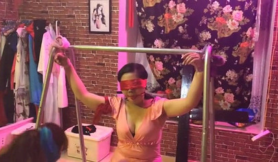 Asian lesbians practice bondage in a BDSM room