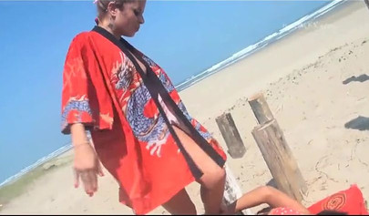 Cute lesbian beauties practice trampling on the beach