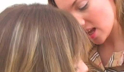 Young and sensual lesbian teens tease each other with a dildo before wet licking