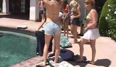 Horny lesbian babes start fooling around by the pool outdoor and end up in an orgy