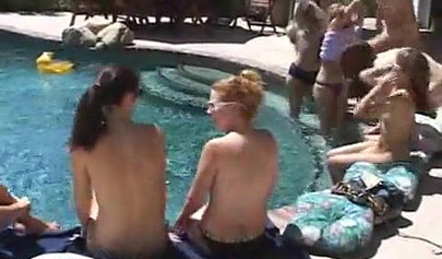 Horny lesbian babes start fooling around by the pool outdoor and end up in an orgy