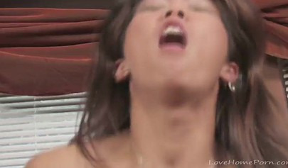 Exotic Asian and sexy brunette use a double ended dildo to fuck to intense orgasms