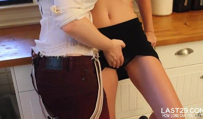 Busty hotties finger each other on a kitchen table