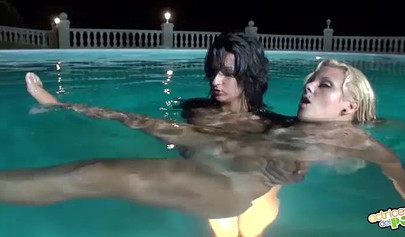 Hot lesbians use a white dildo at the shower