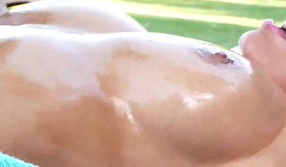 Adorable hotties play with each other's boobs outdoors