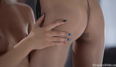 Hot blonde fucks her dark-haired girlfriend with a strap-on