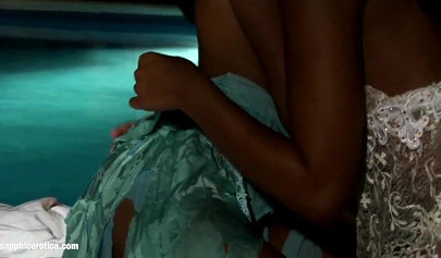 Attractive lesbians enjoying romantic sex in a dark room