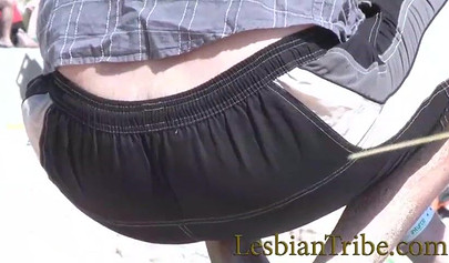 Young lesbians love public kissing and massage on the beach