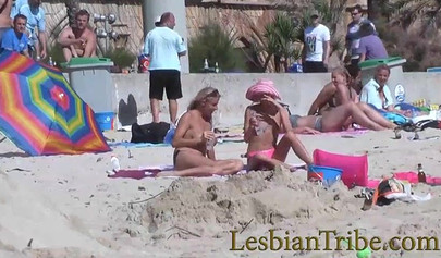 Young lesbians love public kissing and massage on the beach