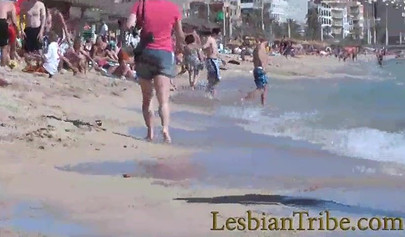 Young lesbians love public kissing and massage on the beach