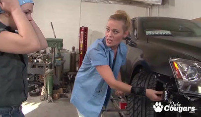 Passionate chicks lick wet pussies in a car repair shop