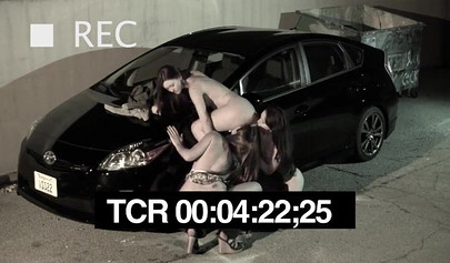 Hot chicks get horny in a car park and lick each other's pussy