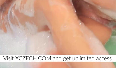 Two beautiful naked lesbians have fun in the gummy pool