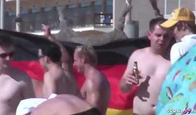 Lesbian couple spends time together on a nude beach