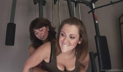 Homemade lesbian sluts playing with a strap-on in the gym