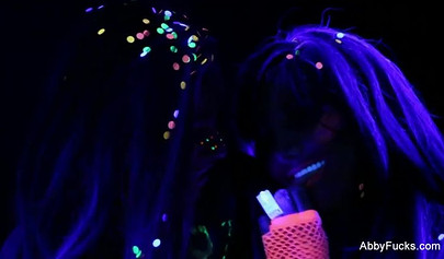 Abigail Mac takes part in a neon lesbian sex scene