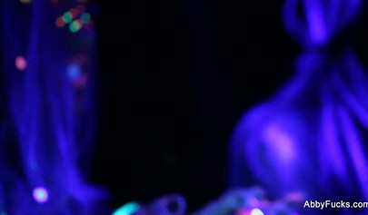 Abigail Mac takes part in a neon lesbian sex scene