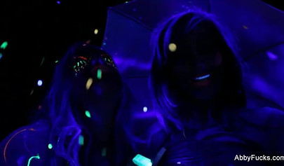 Abigail Mac takes part in a neon lesbian sex scene