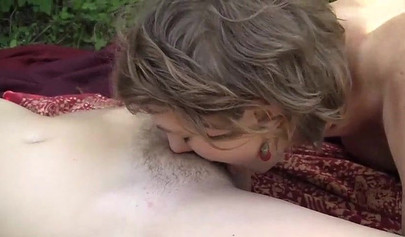 Blonde and her dark-haired girlfriend fucking outdoors