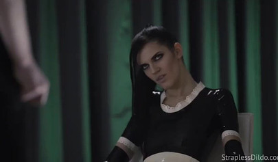 Latex-clad stunner fucks her submissive gf with a strapon