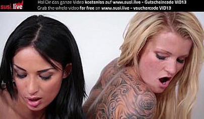 Lesbians toy each other's cunts at the store