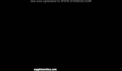 Slender brunettes screw each other with a red toy