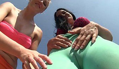 Kinky lesbian couple enjoys outdoor strapon fuck and pussy fisting