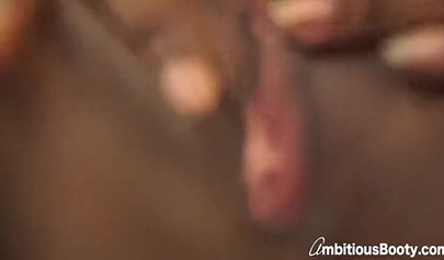 Two big assed ebony lesbians screwing a double-sided toy up close