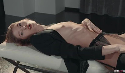 Two hot redhead lesbians are enjoying a strapon fuck