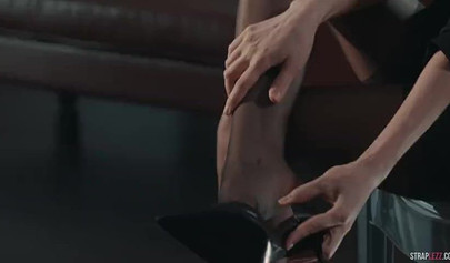 Two hot redhead lesbians are enjoying a strapon fuck