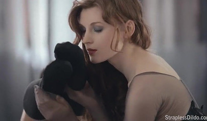 Horny schoolgirls in nylons have fun with a strap-on