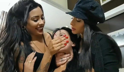 Naughty brunettes dominate their submissive girlfriend