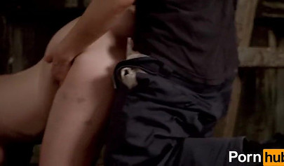 A prisoner fucks a redhead police officer with a strap-on