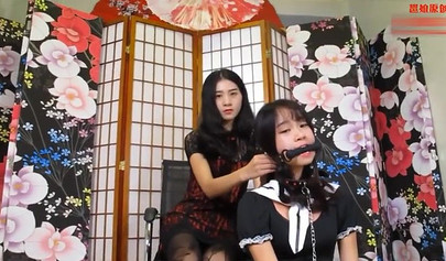 Chinese bondage and a gag in the mouth for a submissive slave