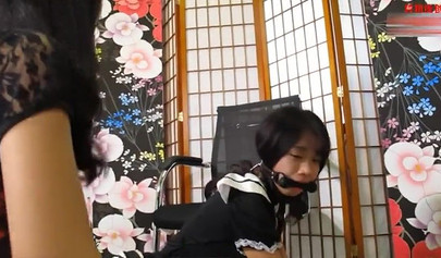 Chinese bondage and a gag in the mouth for a submissive slave