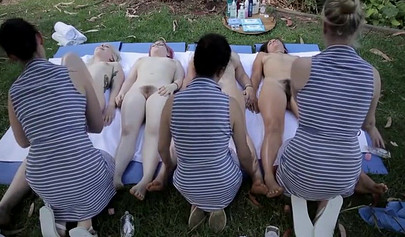 Naked lesbians take part in a wild orgy in the yard